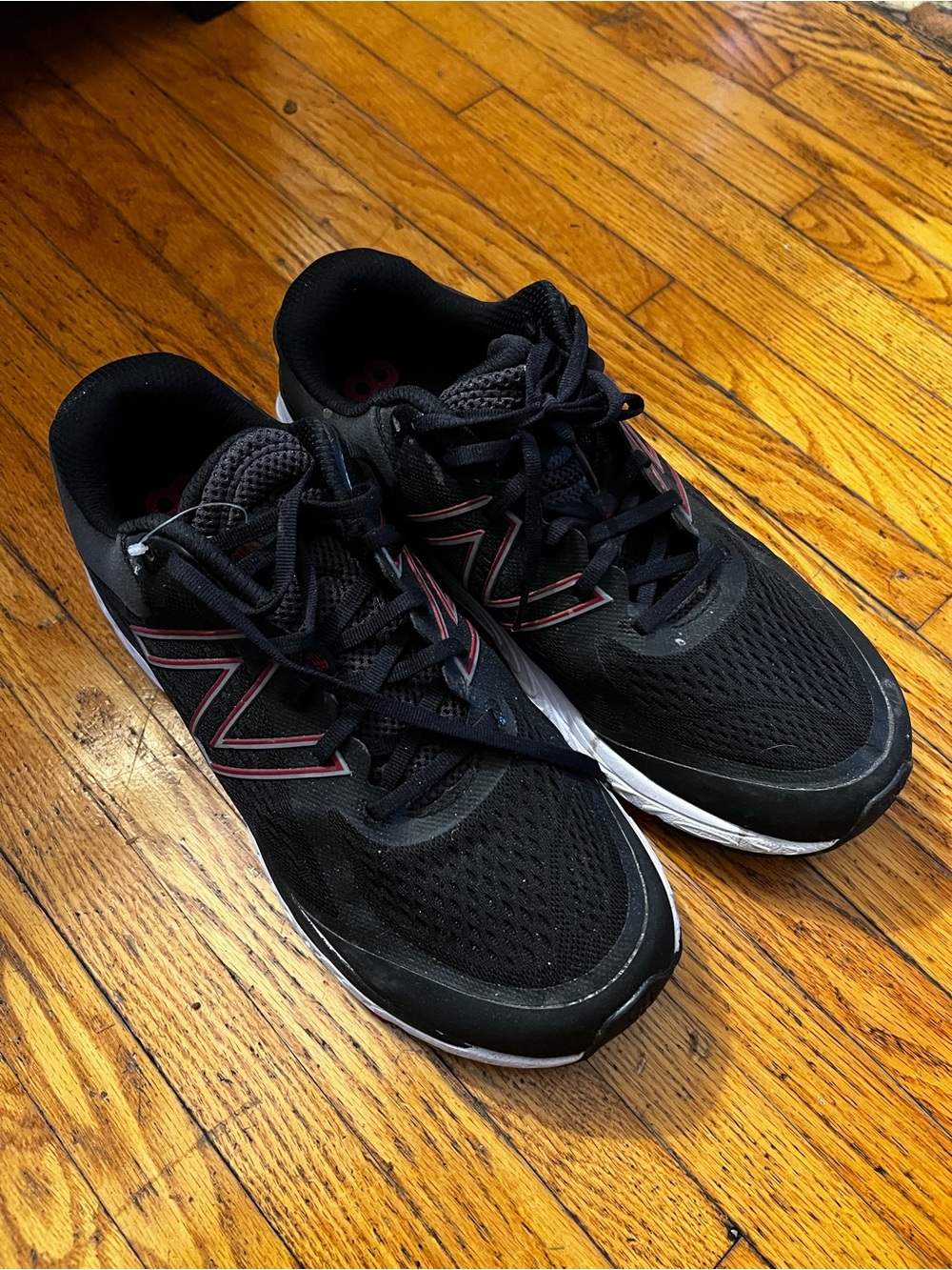 New Balance Black Athletic Running Shoes with Red Accent